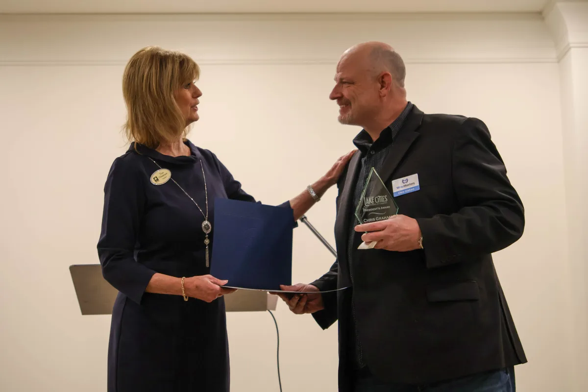 Chris Graham receiving the 2026 Lake Cities Chamber of Commerce Presidential Award
