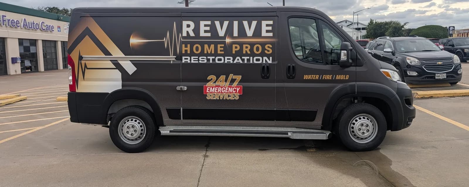 Revive Home Pros Restoration cargo van wrapped with the company name in large letters across the side