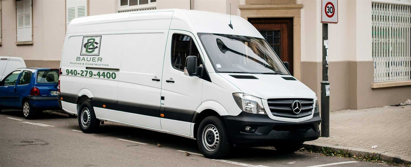 Plain white Sprinter van before Bauer roofing contractor wrap