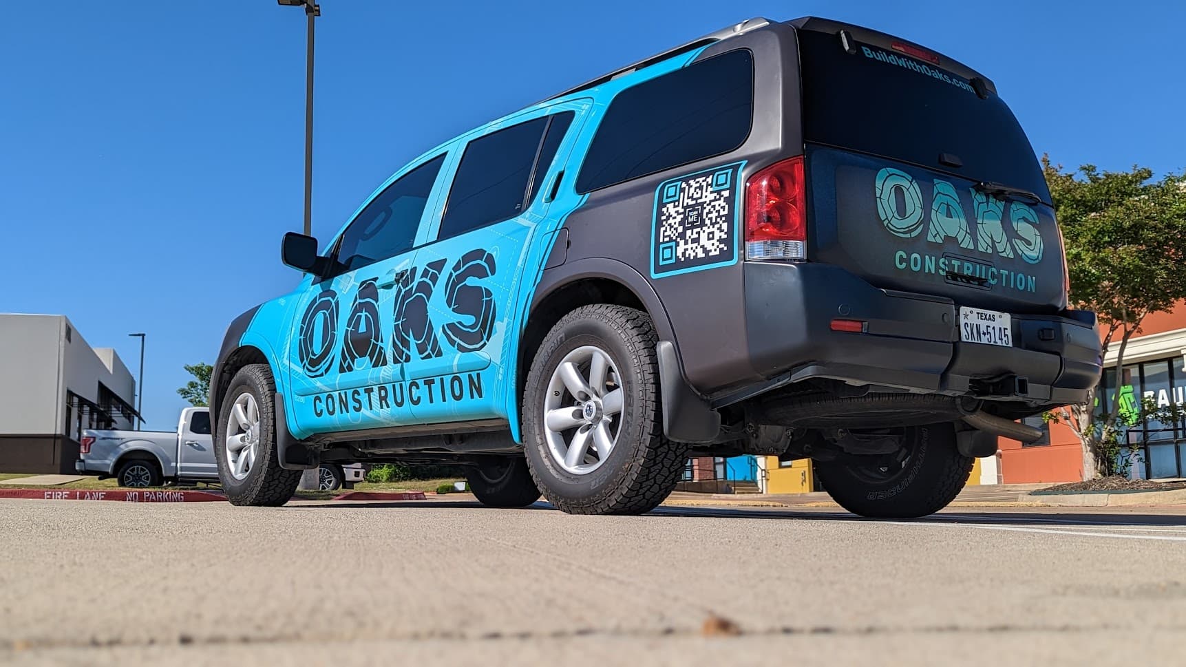 Construction service truck wrap by WrapMasters
