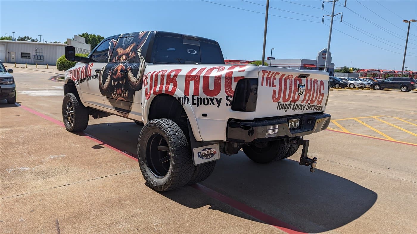 The Job Hog dually truck wrap with a fierce hog graphic and Tough Epoxy Services branding by WrapMasters