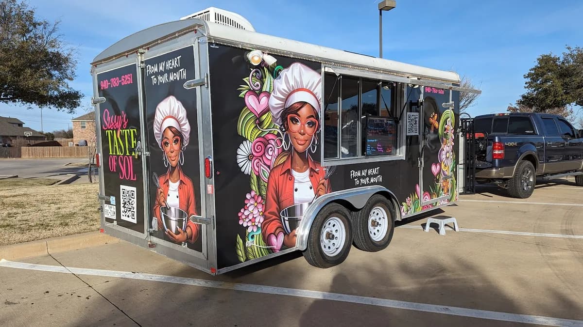 Sissy's Taste of Sol food trailer wrapped with a hand-illustrated chef portrait, flowers, and bold branding by WrapMasters